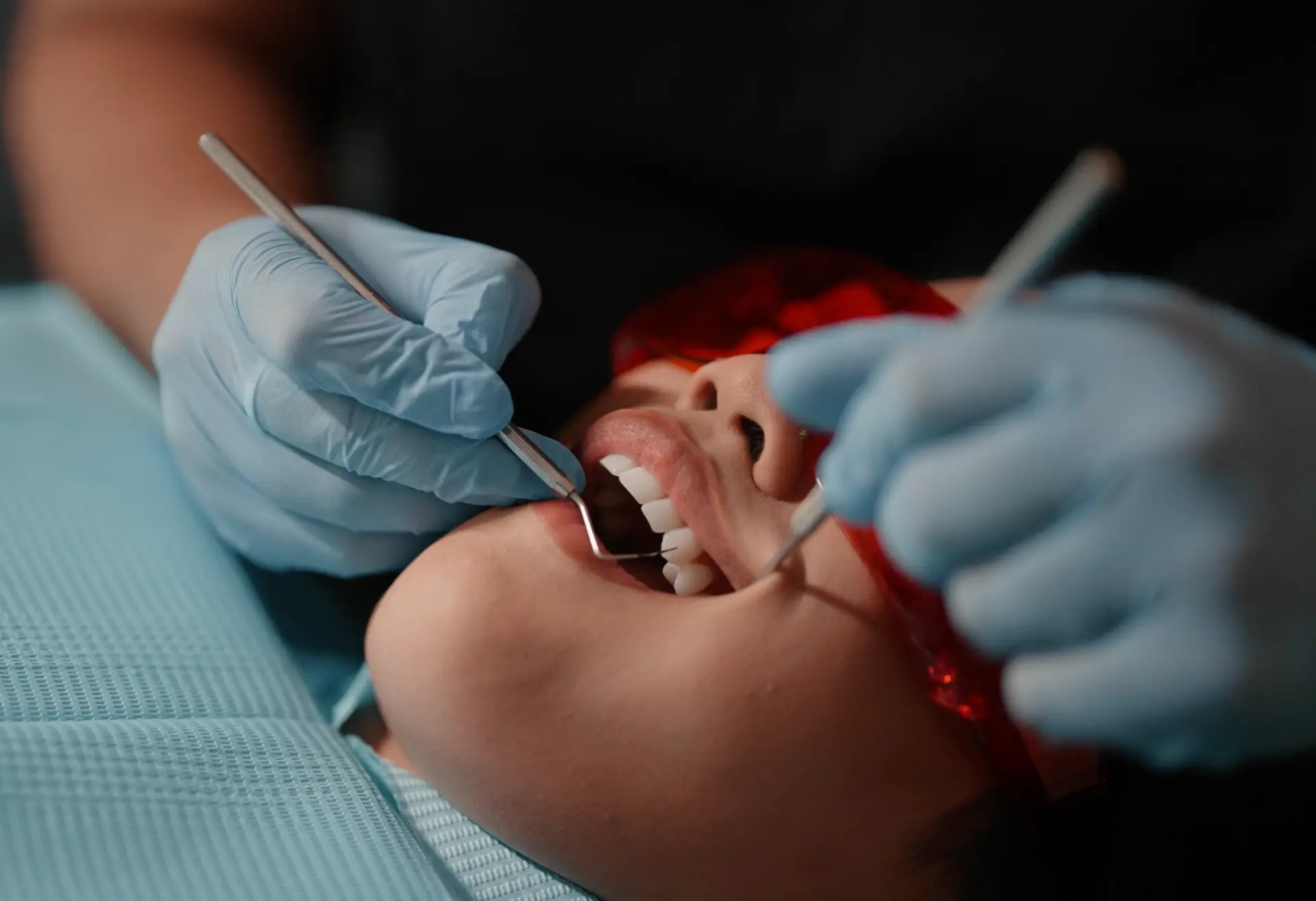 Dental hygienist treating a patient for gum health at Cadbury Dental, Birmingham