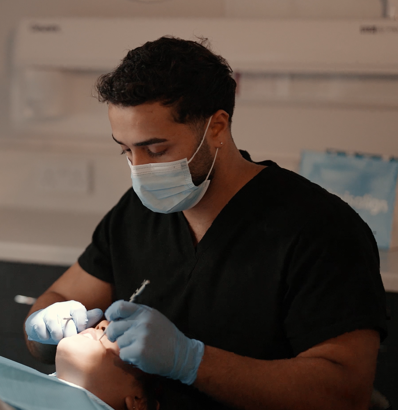 Dr Fareed Kayani placing veneers for a patient at Cadbury Dental, Birmingham